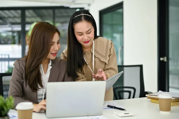 Two Professional Millennial Asian Businesswomen Focuses Business Project Discussing Working — Stock Photo, Image