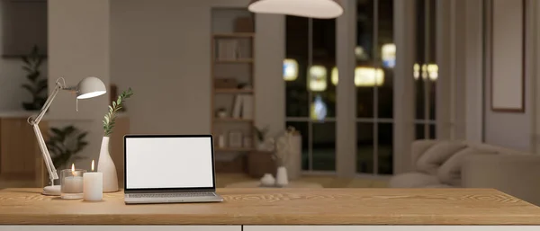 stock image Comfortable and minimal home workspace with white screen laptop computer mockup, candles, tablet lamp and copy space on wooden table in minimal cozy living room. 3d render, 3d illustration