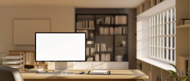 Grafik reklamlarınızı gösteren bir bilgisayar beyaz ekran modeli modern, çağdaş bir ofis odasında ofis malzemeleriyle dolu ahşap bir masanın üzerinde. 3d görüntüleme, 3d illüstrasyon
