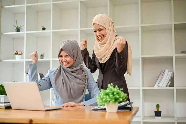 stock image Happy and successful team of Muslim business people celebrating together after the impressive outcome.  