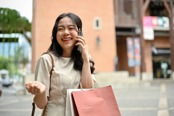 Cheerful Charming Young Asian Woman Casual Clothes Enjoys Talking Phone — Stock Fotó