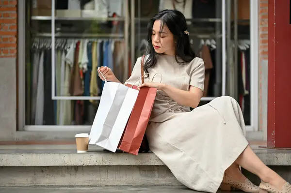 Charming Young Asian Woman Checked Her Purchased Stuff Shopping Bag — Stockfoto