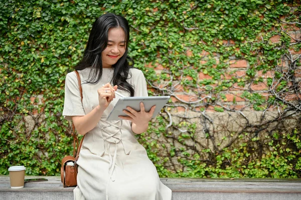 Happy Charming Young Asian Woman Casual Clothes Uses Her Digital — Stockfoto