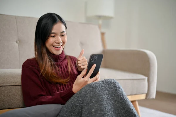 Cheerful Young Asian Woman Cozy Sweater Enjoys Talking Video Call — Stock Photo, Image