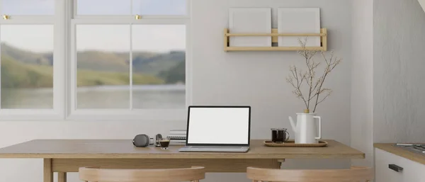 在简约的白色厨房的木制餐桌上 一个笔记本电脑的白色屏幕模型 耳机和装饰 家庭工作空间的概念 3D渲染 3D说明 — 图库照片