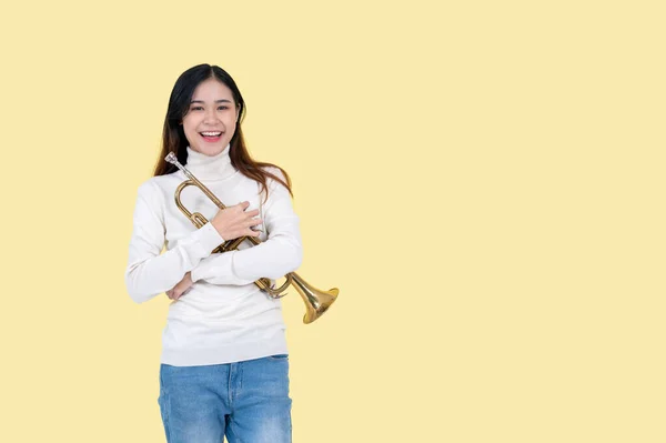 Pretty Talented Asian Woman Holding Trumpet While Standing Isolated Yellow — Stock Photo, Image