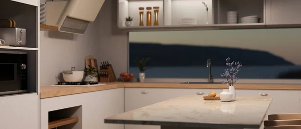A luxury white marble kitchen island or countertop in a modern, minimal kitchen with modern kitchen appliances. 3d render, 3d illustration