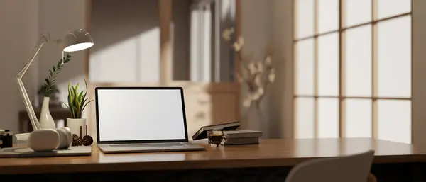 A white-screen laptop mockup on a wooden desk with accessories in a modern contemporary home office or private office. workspace close-up image. 3d render, 3d illustration