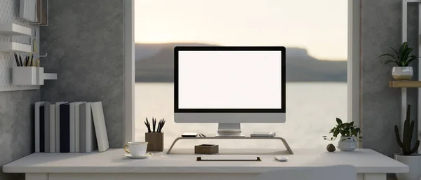 Modern loft office workspace with a white-screen computer mockup on a white desk against the window with nature view, a pegboard on a cement wall, and decor plants. 3d render, 3d illustration