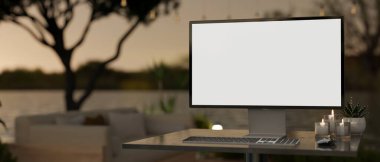 Gün batımı manzaralı güzel bir terasın bulanık arka planına sahip bir masada beyaz ekran bilgisayar modeli. 3d görüntüleme, 3d illüstrasyon