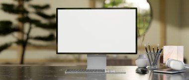 Modern bir Zen Japon ev ofisinde masa üzerinde beyaz ekran bir bilgisayar modeli ve aksesuarlar bulunur. 3d görüntüleme, 3d illüstrasyon