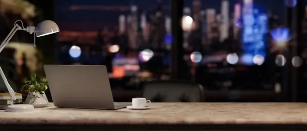 A modern office at night with a city view, featuring a laptop computer, a table lamp, and accessories on a desk. close-up image. 3d render, 3d illustration