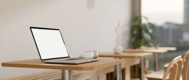 Samimi minimalist bir kahve dükkanının ahşap masasında beyaz ekran maketi ve kulaklığı olan bir dizüstü bilgisayarın yakın çekimi. iş yeri, ortak çalışma alanı, uzaktan çalışma, 3D görüntüleme, 3D illüstrasyon