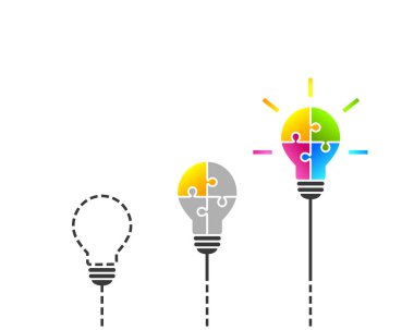 Idea, solution and innovation concept with light bulb made of colorful jigsaw puzzle pieces