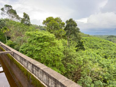 Beatutiful view of the western ghats seen from Mathur Aqueduct which is an elevated concrete aqueduct located in Kanniyakumari district, Tamil Nadu clipart