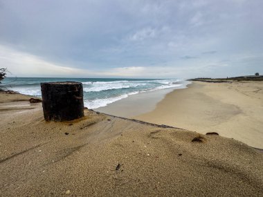 The pier where fishing boats are docked along the Dhanushkodi Beach, located near Arichal Munai. Dhanushkodi is an abandoned town at the south-eastern tip of Pamban Island of the state of Tamil Nadu clipart