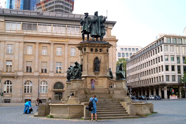 stock image Johannes Gutenberg Monument, inaugurated in 1858, memorial and fountain on the Rossmarkt, sculptural work by Eduard Schmidt von der Launitz, Frankfurt, Germany - May 8, 2022