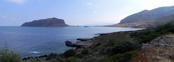 stock image Panoramic view of the Aegean sea coast north of Monemvasia, island with a mountain, connected to the mainland by causeway, Peloponnese, Greece - October 5, 2010