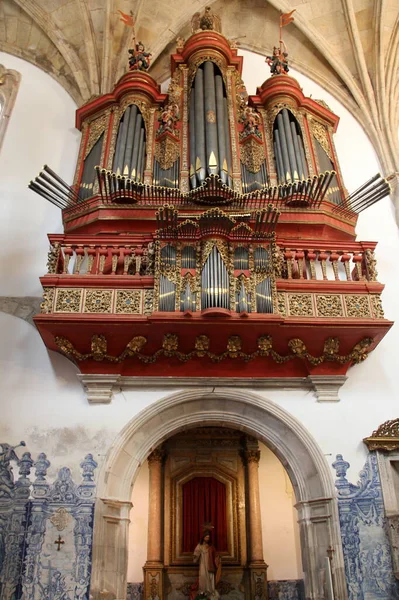 Baroque pipe organ of the 18th century inside the church of Monastery of Santa Cruz, Coimbra, Portugal - July 21, 2021
