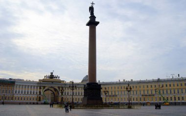 Palace Square, gloomy cloudy day scene, Alexandrian Column in the foreground and General Staff Building in background, St. Petersburg, Russia - April 27, 2012