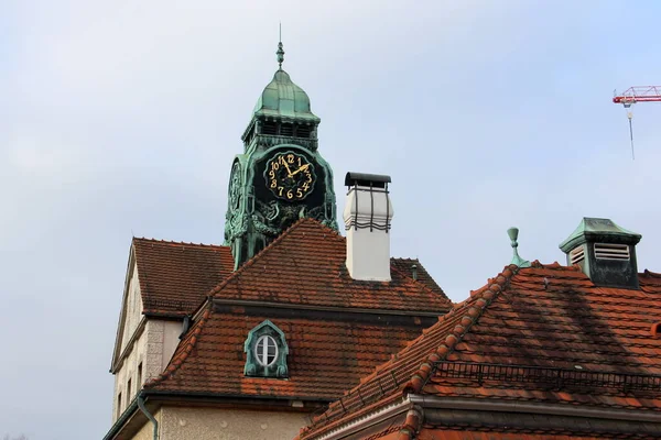 Jugendstil elements of the roof and clock tower, at Sprudelhof, early 20th-century mineral waters spa and hydrotherapy complex, Bad Nauheim, Germany - Janary 29, 2023