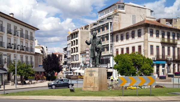 Largo Cardal, circular public square in the town center, with the statue of Luciano Cordeiro, 19th century public figure, Mirandela, Portugal - May 23, 2023