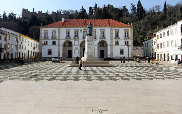 Monument to Gualdim Pais, founder of the town, in the Republic Square, Town Hall building in background, Tomar, Portugal - February 6, 2024