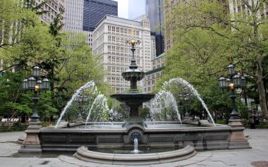 Water fountain in the City Hall Park, designed by Jacob Wrey Mould, opened in 1871, New York, NY, USA - May 11, 2020 clipart