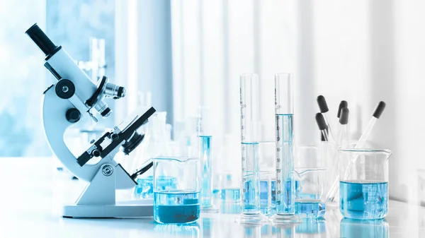 laboratory research and development background of laboratory instrument microscope and lab glassware