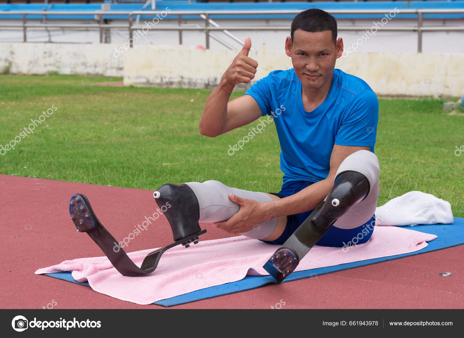 Asian Paralympic Athlete Sporting Two Prosthetics Running Blades