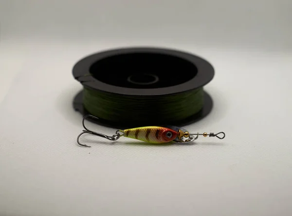 New spinner and braided fishing line isolated