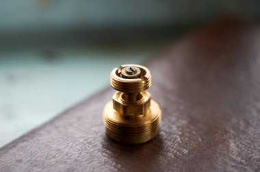 Photo of brass valve from gas meter on the table
