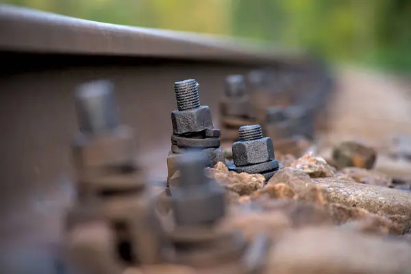 Bolts Fastening Rails Sleepers Covered Oil — Stock Photo, Image