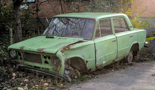 Abandoned soviet car with damaged body