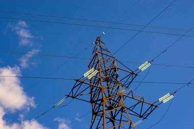 electricity transmission pylon silhouette against blue sky at the evening clipart
