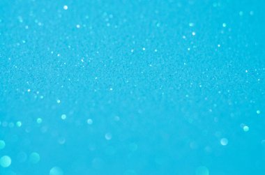 Bulanık parıltıların mavi arka planı. Bokeh 'in etrafında. Yumuşak odak