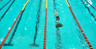 Aquatics monofin underwater sports. Athletes competing in blue swimming pool. Finswimming World Championships. clipart