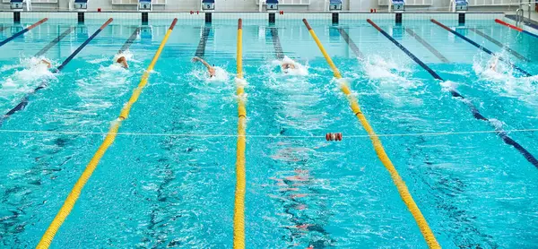 stock image Turquoise swimming pool lanes, a symbol of sport. Aquatics monofin underwater sports. Athletes competing in blue swimming pool.