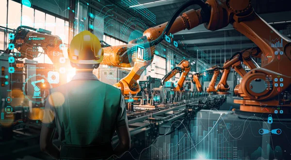 Factory Female Industrial Engineer working with Ai automation robot arms machine in intelligent factory industrial on real time monitoring system software.Digital future manufacture.