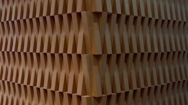 Modern mimari ahşap bir duvarın yakın çekim görüntüsü üç boyutlu tekrar eden bir blok deseni içeriyor. Tasarım, görsel olarak çarpıcı bir doku yaratmak için açılı ahşap elementler kullanıyor, geometrik estetik ile karıştırarak. Bizim için uygun.