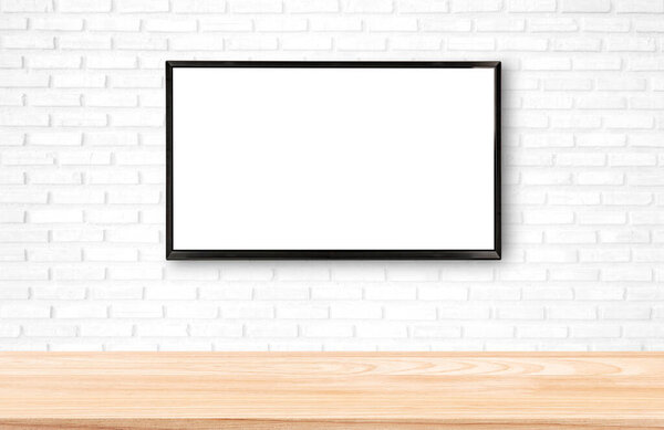 Smart TV display on white brick wall