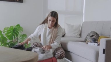 Young girl preparing the suitcases to go on a trip. Concept of travel. Selective focus