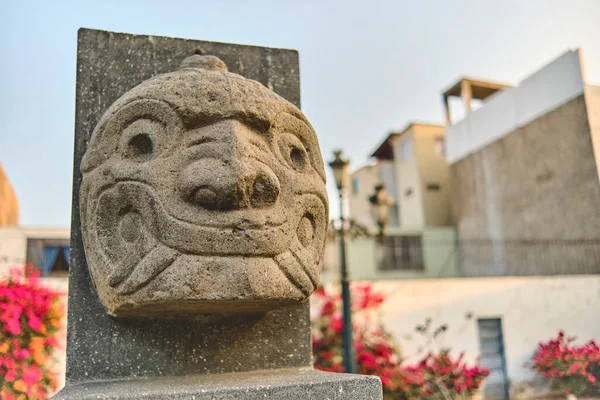 A Nail head, Cabeza Clava, or zoomorphic face carved in stone from the pre incan culture Chavin in Ancash Region, Peru