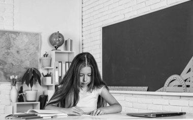 try and try again. back to school. formal and nonformal education. schoolgirl at lesson. child making notes. college student kid do homework. happy childhood. teenager girl study in classroom.
