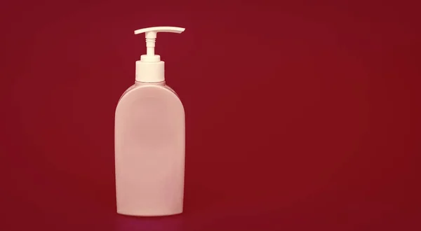 daily habit and personal care. skincare beauty cosmetic on orange background. toiletries for hygiene. presenting soap dispenser product. unbranded sanitizer advertisement.