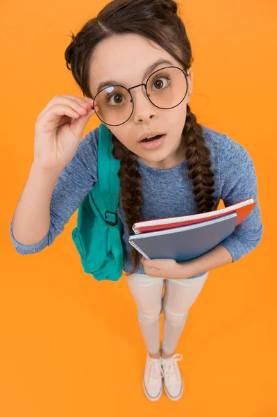 Always look smart and beautiful. Smart look of schoolchild. Little schoolgirl wear eyeglasses. Small child back to school. School look. Fashion and beauty. Dedicated to learning.