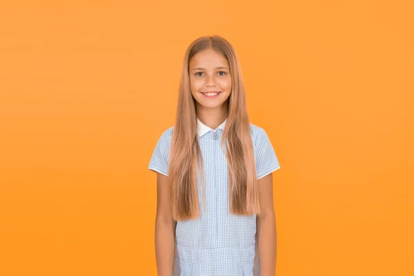 Kid girl long healthy straight hair. Main thing is keeping it clean. Use gentle shampoo and warm water. Little girl grow long hair. Teaching child healthy hair care habits. Strong hair concept.