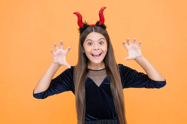 little monster. celebrate the holidays. cunning little demon. halloween devil girl. happy childhood. funny teenage child in imp horns. cheerful kid having fun. carnival costume party. trick or treat.
