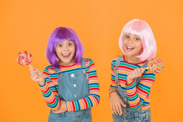 Sweet life. Anime cosplay party concept. Happy little girls. Anime fan. Vibrant characters fantastical themes. Modern childhood. Kids with artificial hairstyles eating lollipops. Anime convention.
