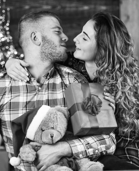 True love. Happiness and joy. Best holiday. Christmas time. Happy woman and man. Celebrate new year at home. Spread love. Holiday gift. Couple in love making surprise for each other. Holiday mood.